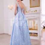 Women’s elegant rich satin self-floral work floor length evening gown in sky blue back side view