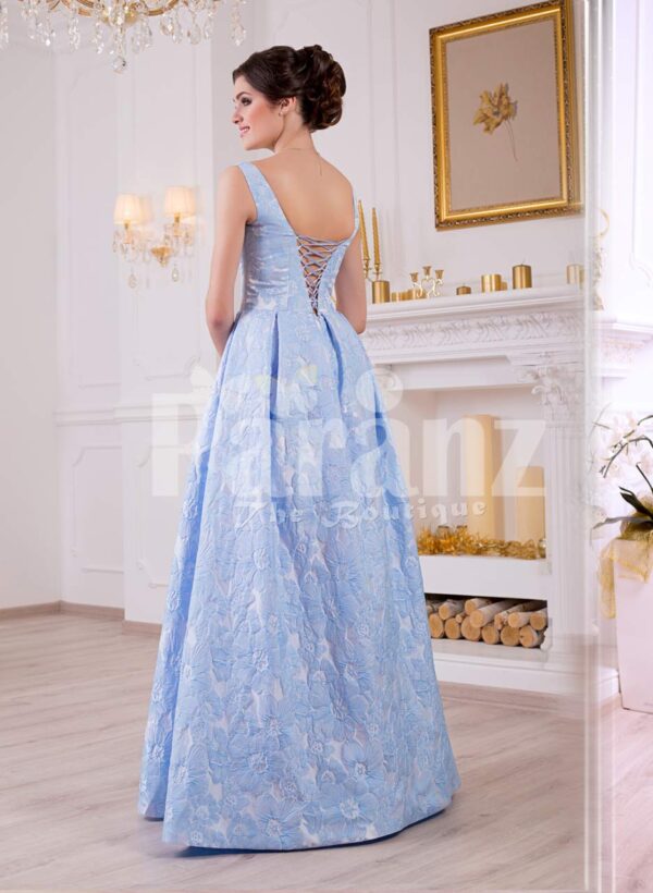 Women’s elegant rich satin self-floral work floor length evening gown in sky blue back side view