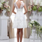 Women’s elegant tea length rich satin wedding dress with rich rhinestone works back side view