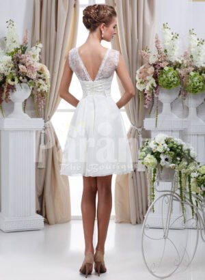 Women’s elegant tea length rich satin wedding dress with rich rhinestone works back side view
