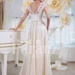Women’s elegant wedding gown with tulle skirt and lacy royal bodice back side view