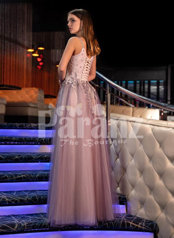 Women’s exclusive mauve evening gown with royal appliquéd bodice and side slit tulle skirt back side view