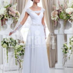 Women’s floor length sleek satin wedding gown with floral lace work in white