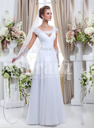 Women’s floor length sleek satin wedding gown with floral lace work in white