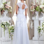Women’s floor length sleek satin wedding gown with floral lace work in white back side view