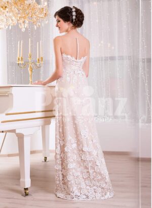 Women’s floor length sleek tulle evening gown with all over white floral lace appliqués back side view