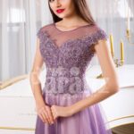 Women’s floor length tulle skirt evening gown with royal rhinestone studded bodice in mauve