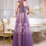 Women’s floor length tulle skirt evening gown with royal rhinestone studded bodice in mauve back side view