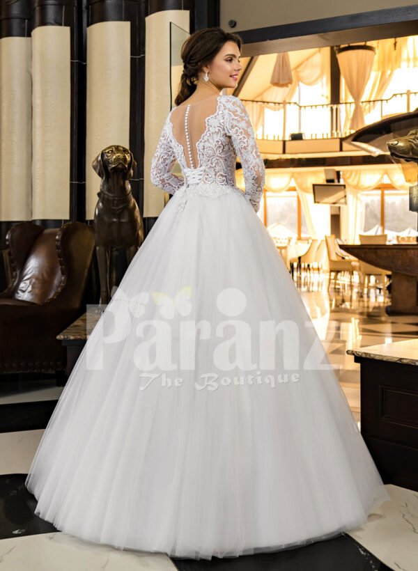 Women’s full sleeve glam lacy bodice and tulle skirt floor length wedding gown back side view