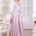 Women’s full sleeve lace appliquéd bodice evening gown with sleek satin long skirt side veiw