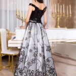 Women’s glam black bodice floor length evening gown with silver tulle skirt back side view