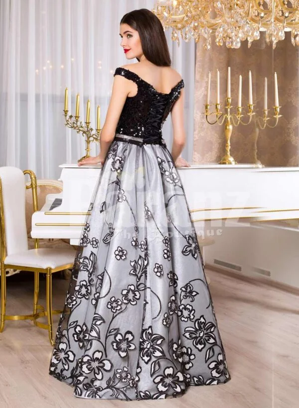 Women’s glam black bodice floor length evening gown with silver tulle skirt back side view