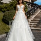 Women’s glam white sleeveless wedding tulle gown with royal bodice