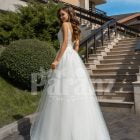 Women’s glam white sleeveless wedding tulle gown with royal bodice back side view