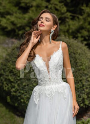 Women’s glam white sleeveless wedding tulle gown with royal bodice close view