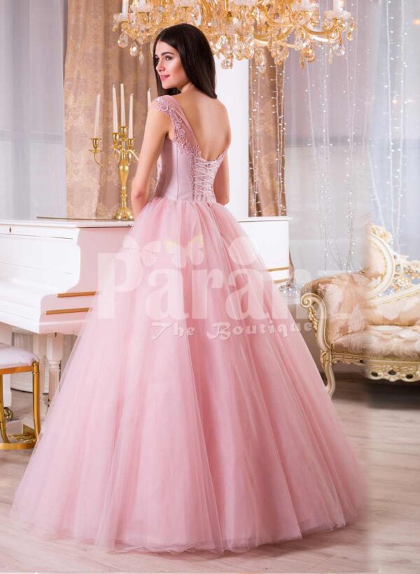 Women’s high volume tulle skirt evening gown with lacy pink bodice back side view