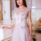 Women’s light pink evening gown with long tulle skirt and pink flower appliquéd bodice