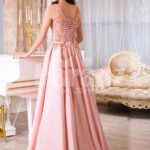 Women’s long evening glam gown with royal rhinestone bodice in peach hue back side view