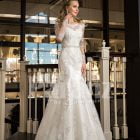 Women’s mermaid styled rich satin wedding gown with rich pearl and rhinestone works