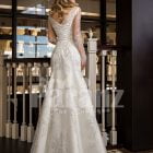 Women’s mermaid styled rich satin wedding gown with rich pearl and rhinestone works back side view