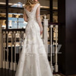Women’s mermaid styled rich satin wedding gown with rich pearl and rhinestone works back side view