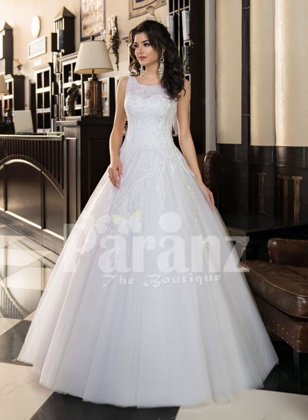 Women’s milk-white high volume tulle skirt wedding gown with pleasing bodice