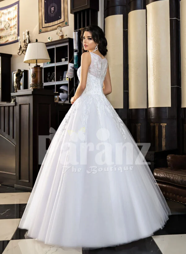 Women’s milk-white high volume tulle skirt wedding gown with pleasing bodice back side view