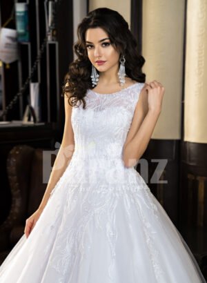 Women’s milk-white high volume tulle skirt wedding gown with pleasing bodice cloase view