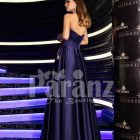 Women’s navy floor length rich satin evening gown with stylish off-shoulder bodice back side view