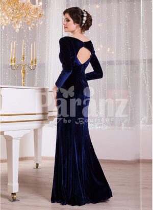 Women’s navy velvet floor length evening gown with elegant white lace works back side view