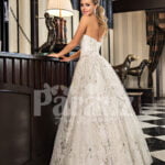 Women’s off-shoulder celebrity style glam glitz tulle skirt wedding gown back side view