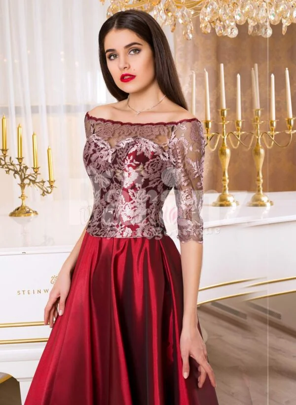 Women’s off-shoulder evening gown with silver appliqués and satin maroon skirt