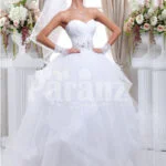 Women’s off-shoulder super stylish pearl white wedding gown with high volume tulle skirt