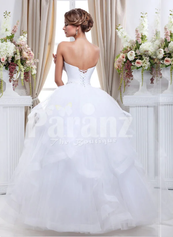 Women’s off-shoulder super stylish pearl white wedding gown with high volume tulle skirt back side view