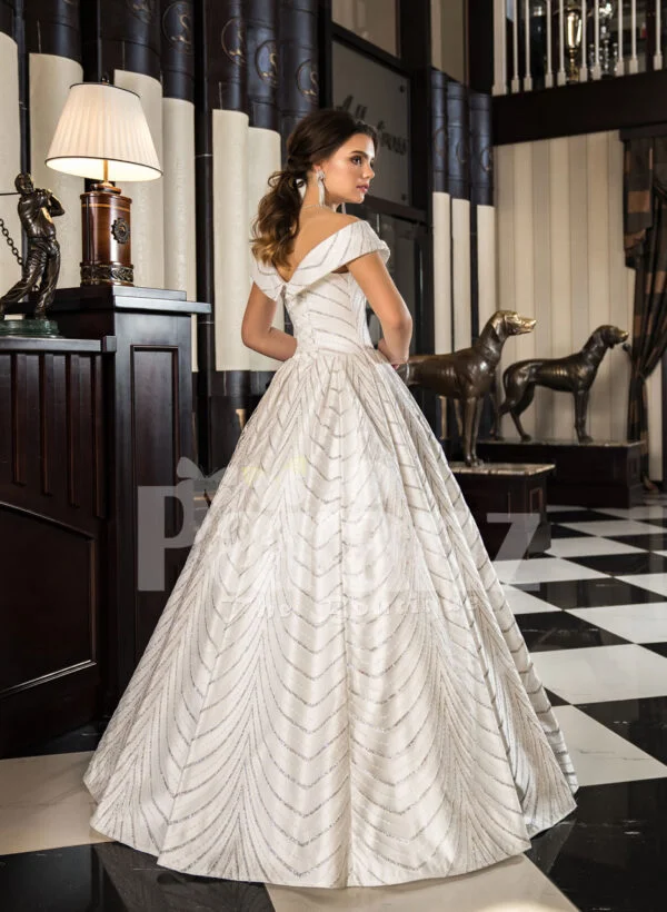 Women’s off-shoulder super stylish rich satin flared wedding gown with tulle skirt underneath back side view