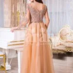 Women’s peach orange sleek tulle skirt evening gown with royal sequin bodice back side view