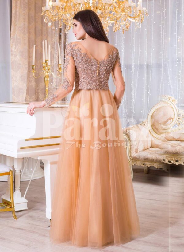 Women’s peach orange sleek tulle skirt evening gown with royal sequin bodice back side view