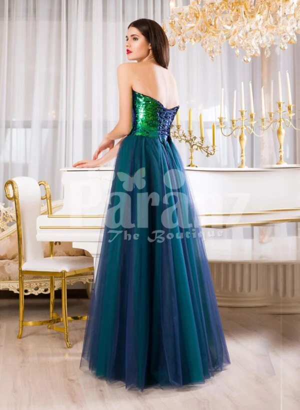 Women’s peacock green off-shoulder sequin bodice evening gown with tulle skirt back side view