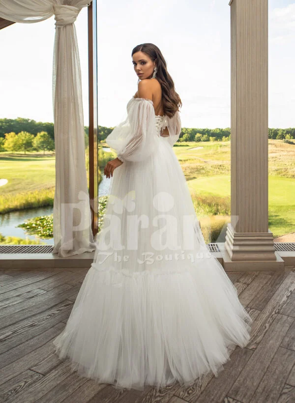 Women’s pearl white off-shoulder glam tulle frill wedding gown back side view