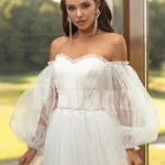 Women’s pearl white off-shoulder glam tulle frill wedding gown close view