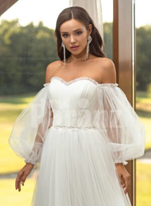 Women’s pearl white off-shoulder glam tulle frill wedding gown close view