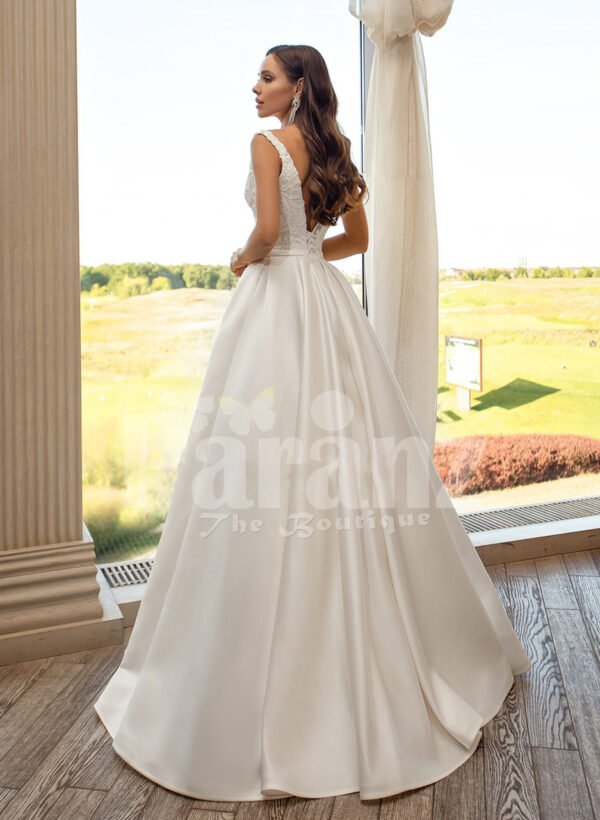 Women’s pearl white rich satin flared skirt wedding gown with tulle skirt underneath back side view