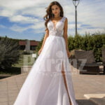 Women’s pearl white side slit tulle wedding gown with stunning lacy bodice