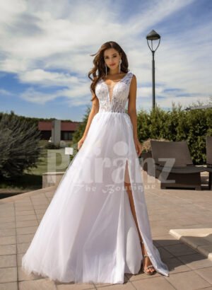 Women’s pearl white side slit tulle wedding gown with stunning lacy bodice
