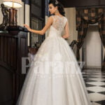 Women’s pretty princess high volume tulle wedding gown in white back side view