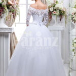 Women’s pretty princess style lacy full sleeve wedding gown with flared tulle skirt back side view