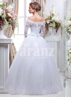 Women’s pretty princess style lacy full sleeve wedding gown with flared tulle skirt back side view