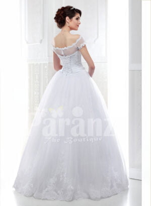 Women’s pretty princess style pearl white flared tulle skirt wedding gown back side view