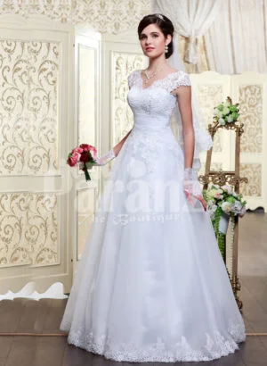 Women’s princess style rich white satin floor length wedding gown with tulle skirt underneath