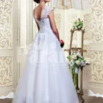 Women’s princess style rich white satin floor length wedding gown with tulle skirt underneath back side view